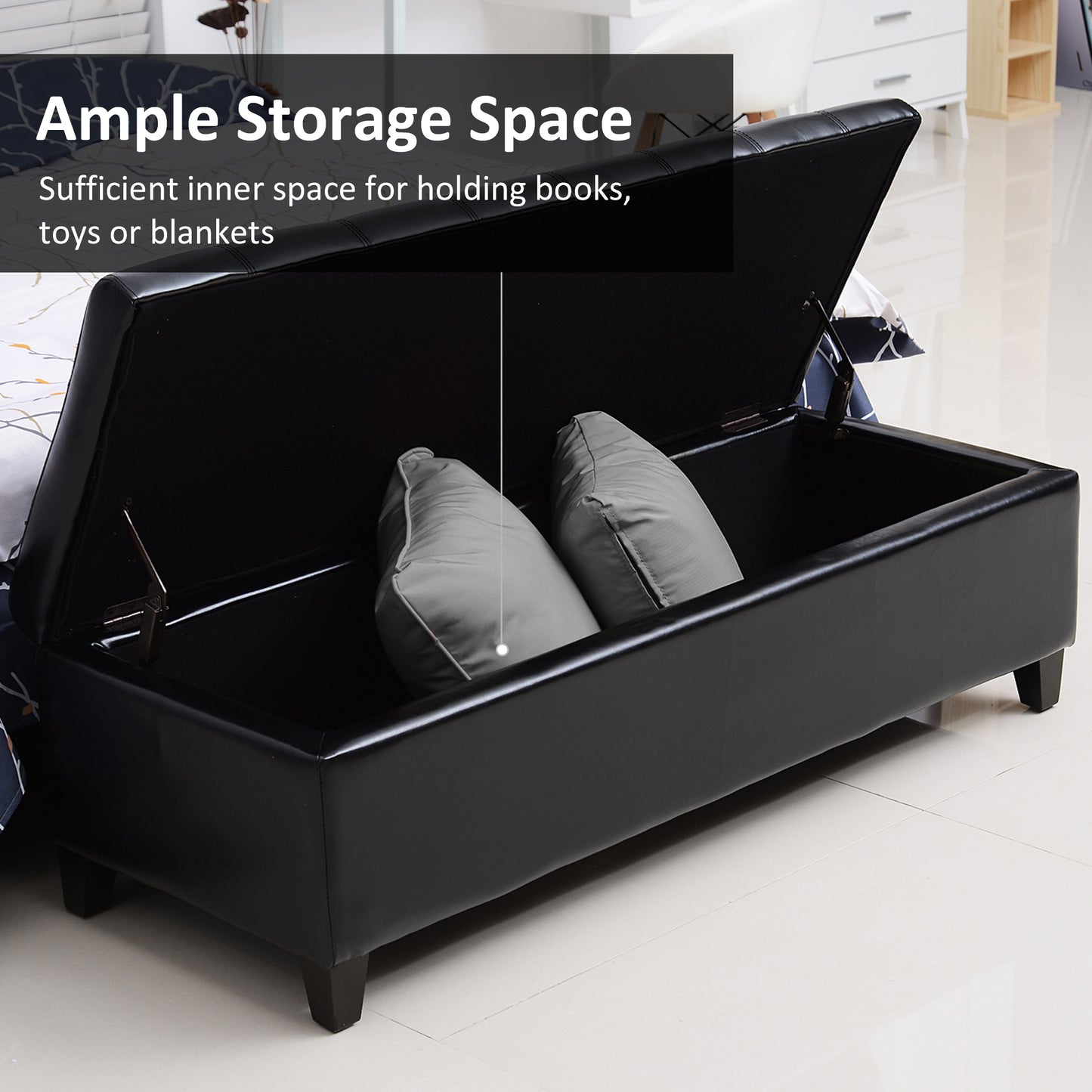 Black faux leather storage ottoman with plush pillows inside offering ample storage space