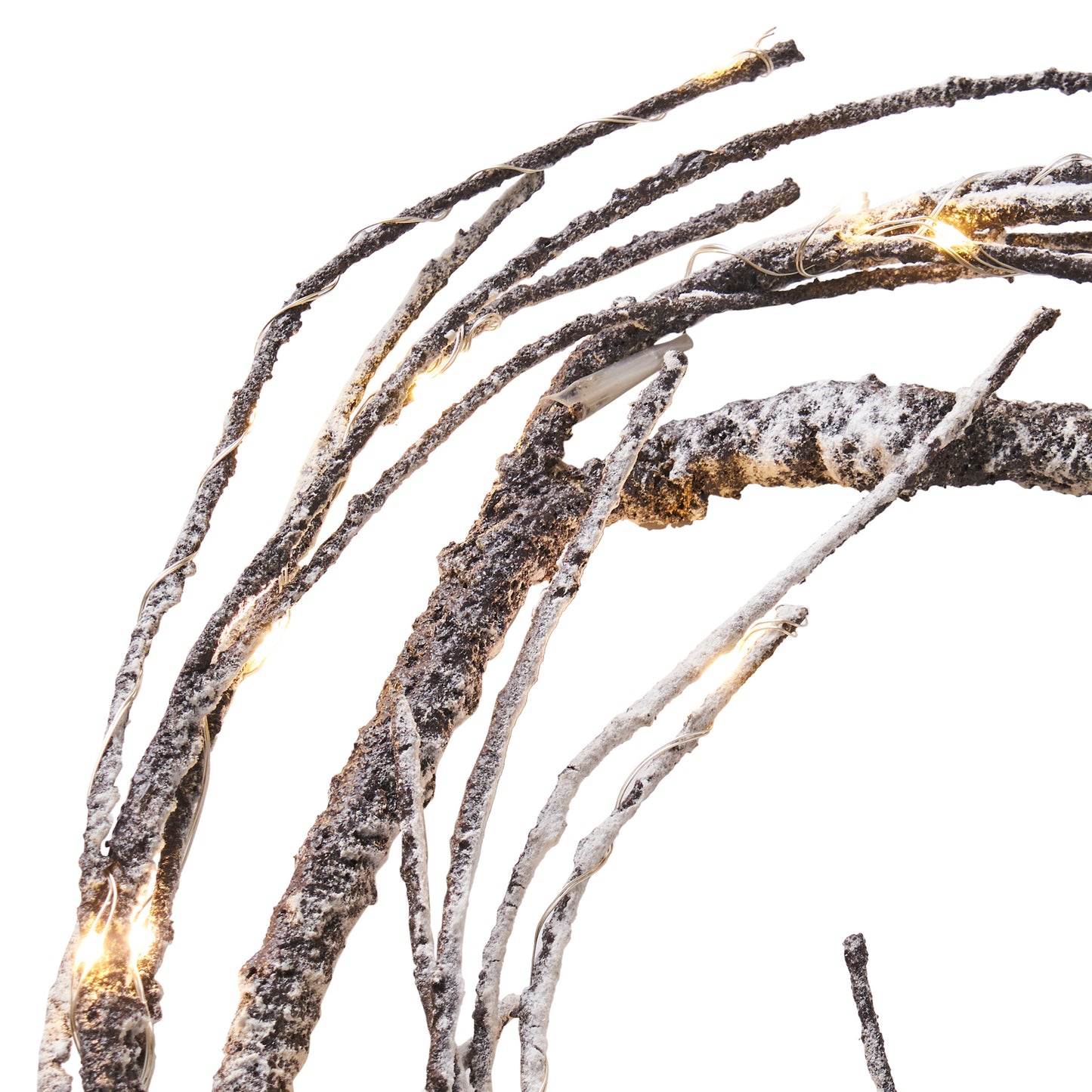 Frosted twig branches with warm white LED lights create a whimsical winter display