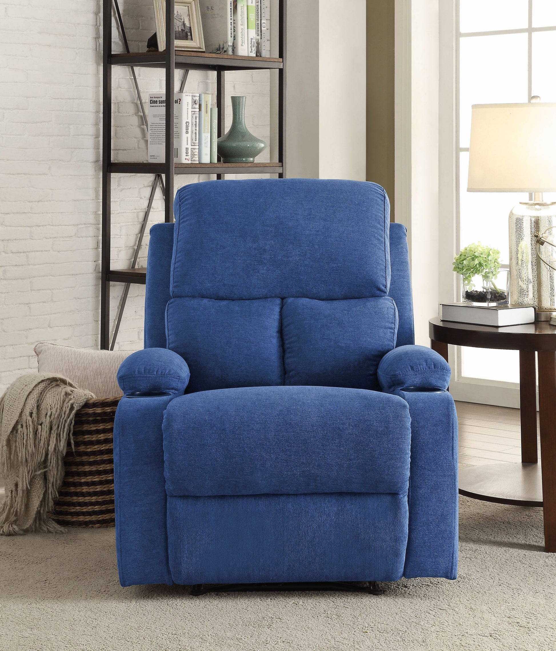 Comfortable blue fabric recliner with plush cushioning and builtin cup holder for relaxation