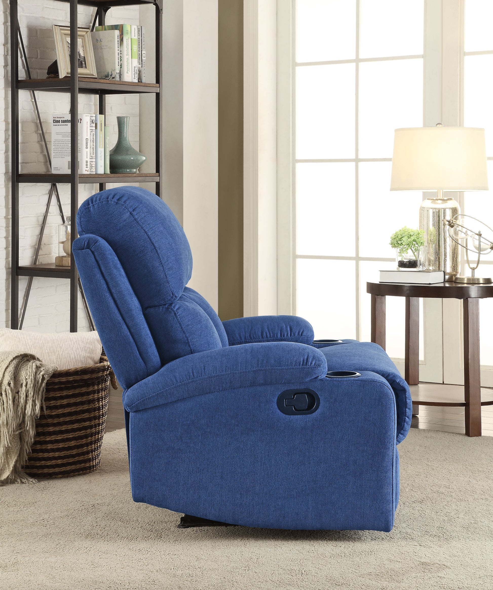 Recliner chair with plush blue fabric and builtin cup holders for ultimate comfort