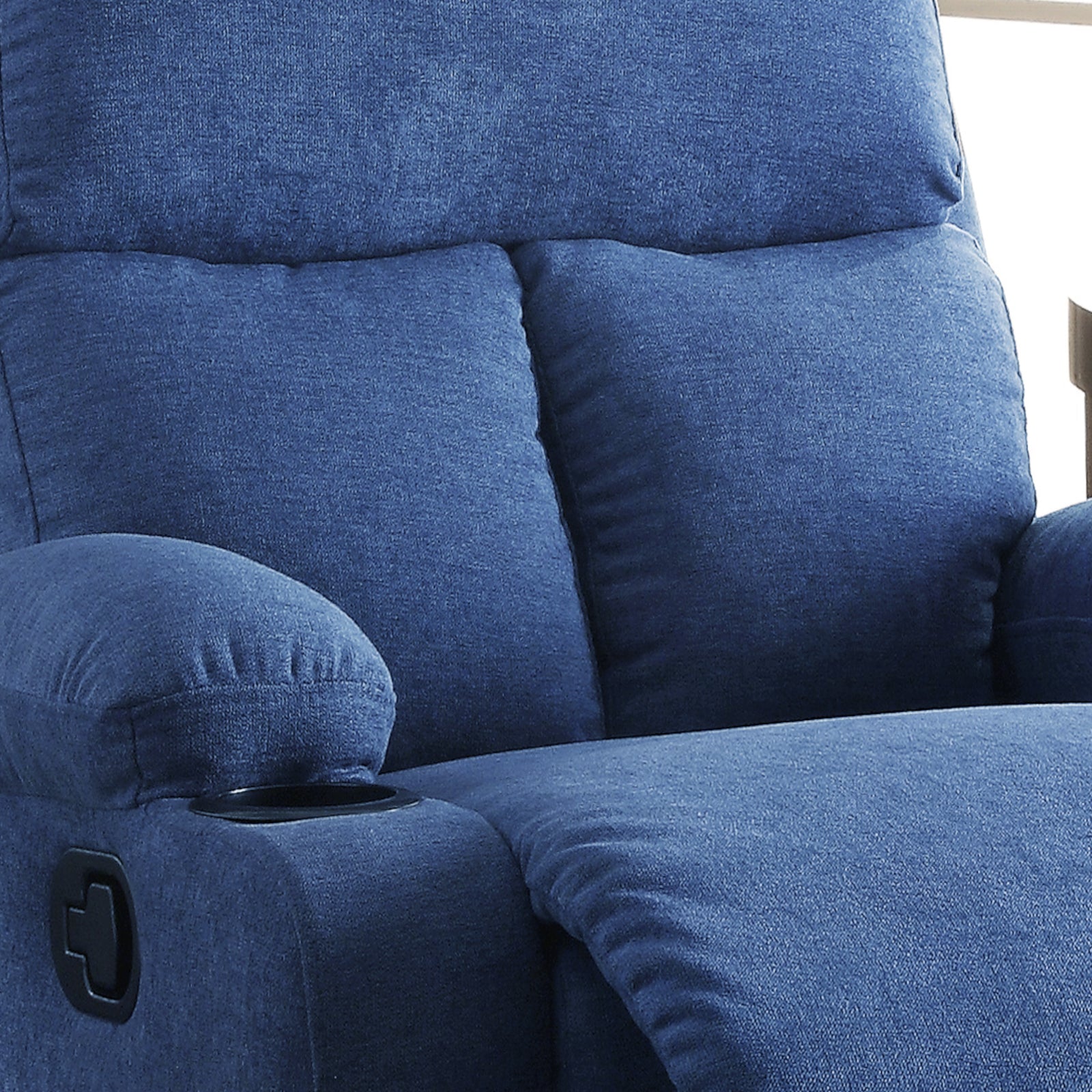 Comfortable navy blue recliner chair with plush cushioning and builtin cup holder