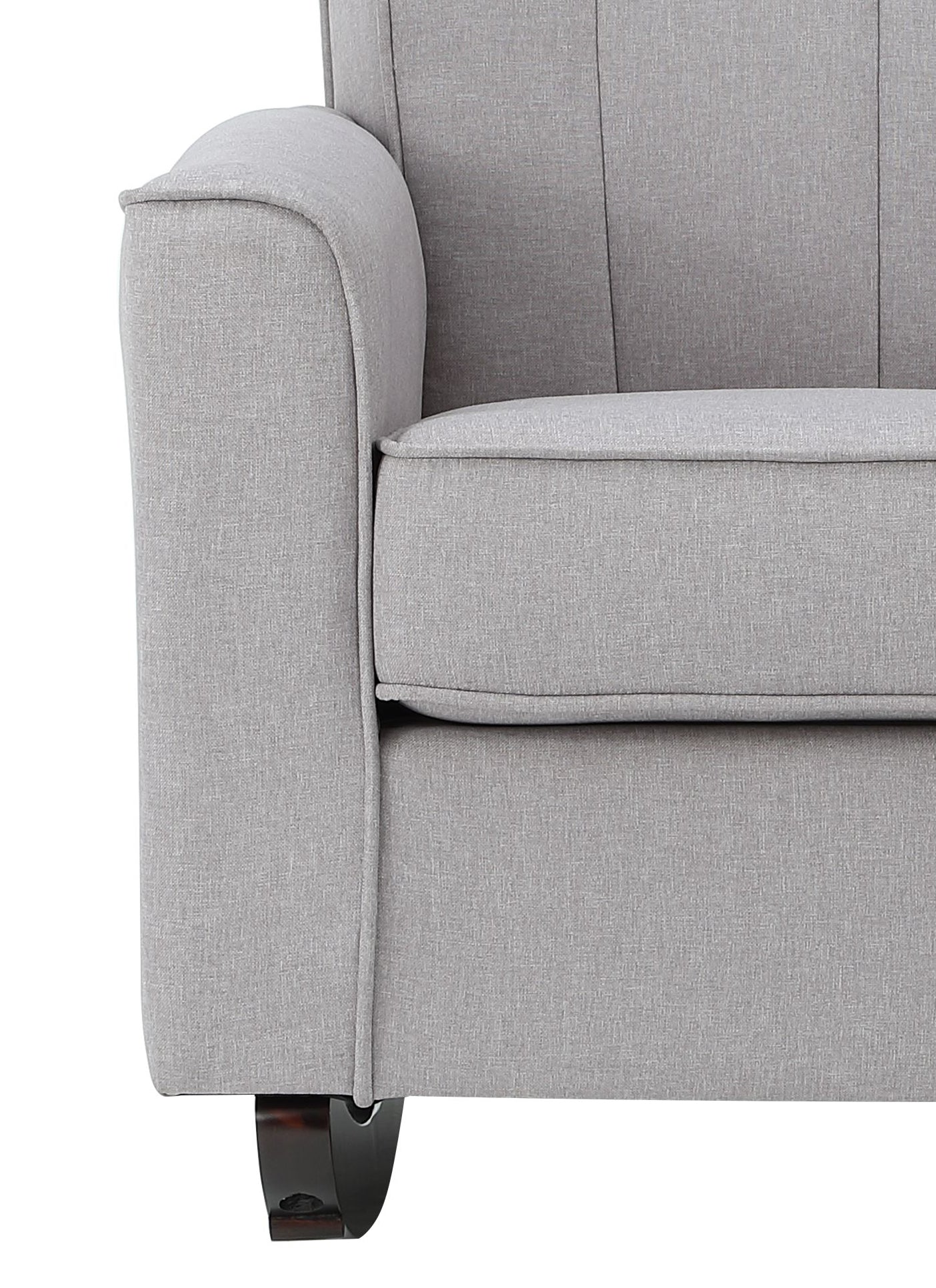 Closeup of a plush grey fabric sofa armrest with subtle stitching details