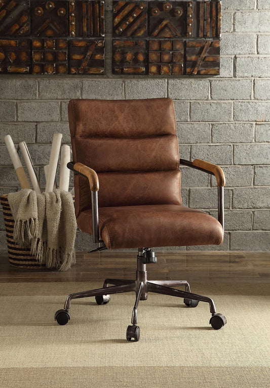 Brown faux leather executive office chair with tufted seat and adjustable height