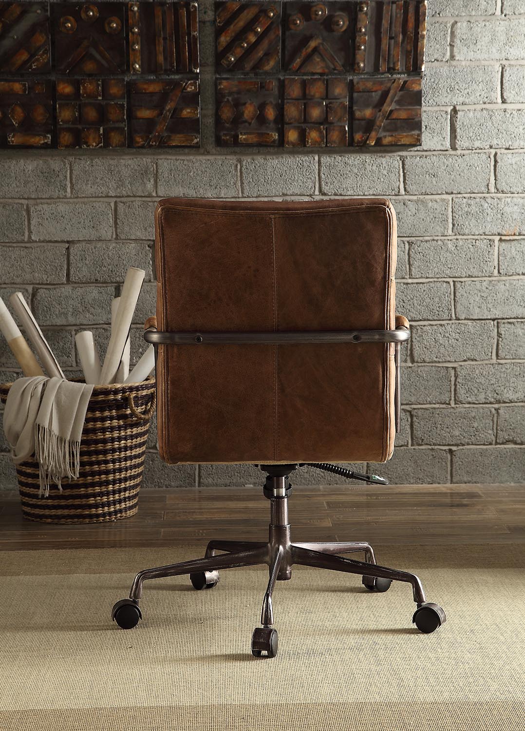 Brown leather office chair with distressed metal base and casters