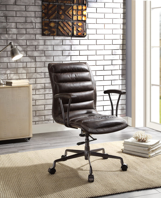 Dark brown faux leather executive office chair with quilted seat and back