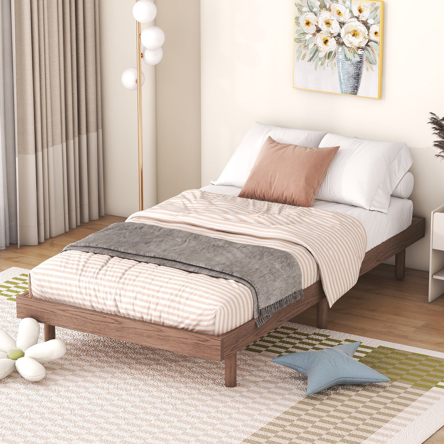 Solid wood platform bed frame with striped bedding and plush pillows