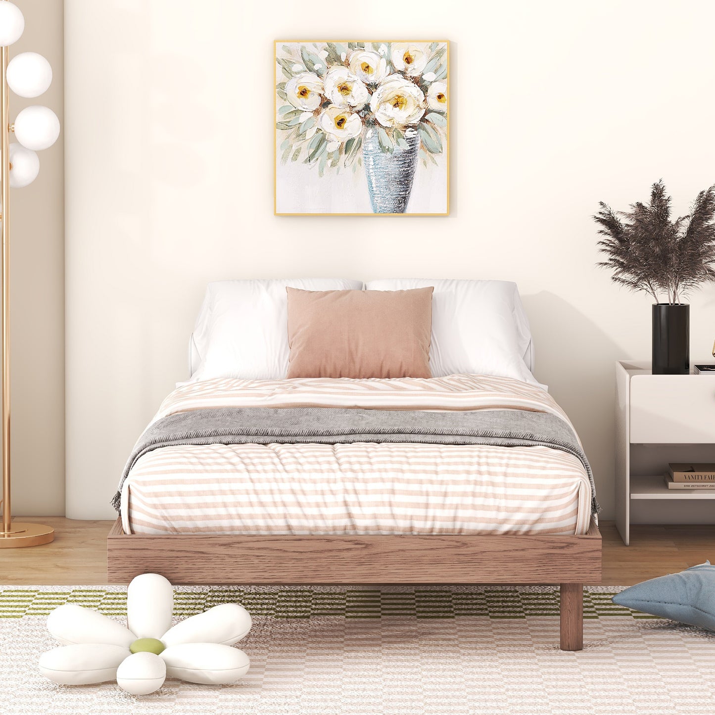 Wooden platform bed with striped bedding and accent pillow