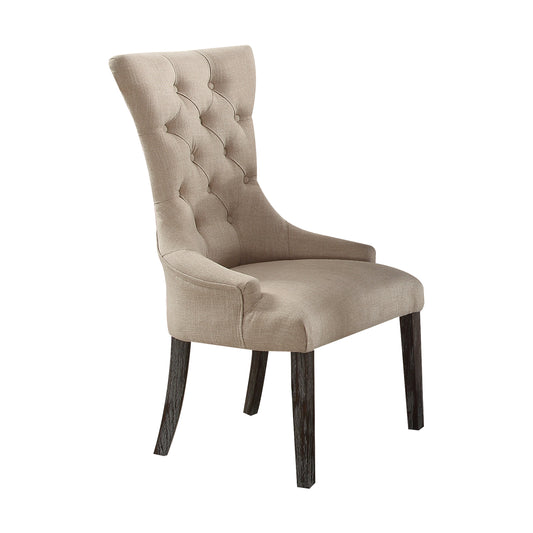 Tufted beige fabric dining chair with dark wood legs and elegant button details