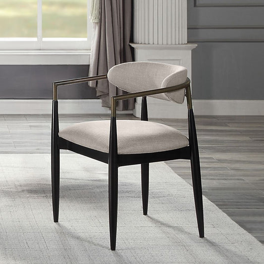 Modern upholstered accent chair with black wood frame and brass arms