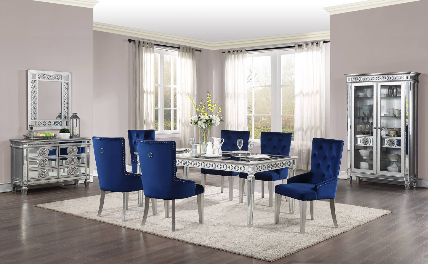 Luxurious navy blue velvet dining chairs with silver nailhead trim and ring pull