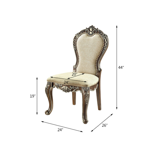 Ornate carved brown wood frame armchair with beige upholstered seat and back