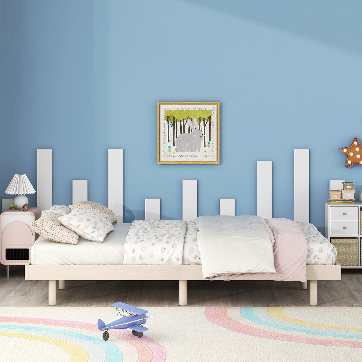Twin bed with playful patterned bedding and plush pillows