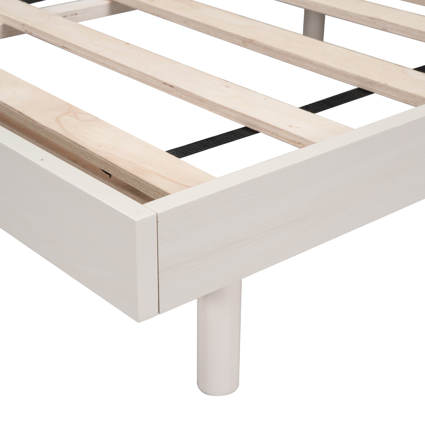 White wooden bed frame detail with slatted support