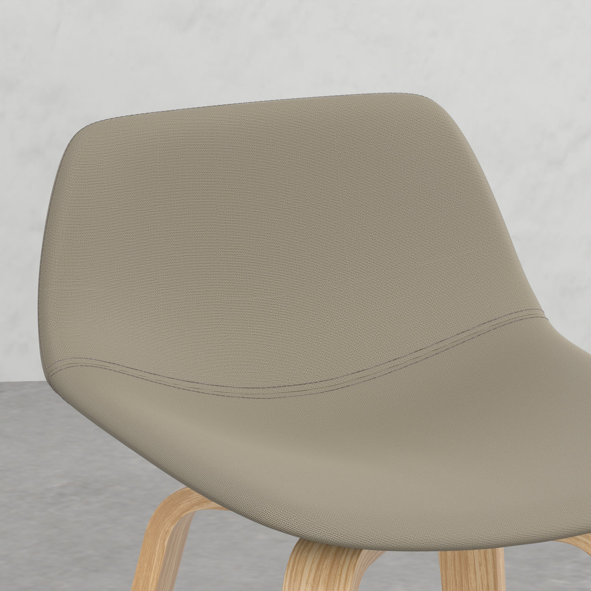 Upholstered dining chair with curved back and light wood legs