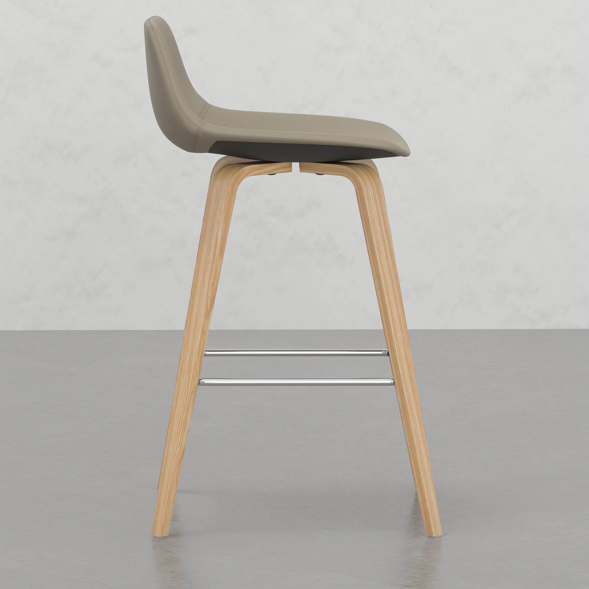 Tan fabric modern bar stool with curved wooden legs and chrome footrest