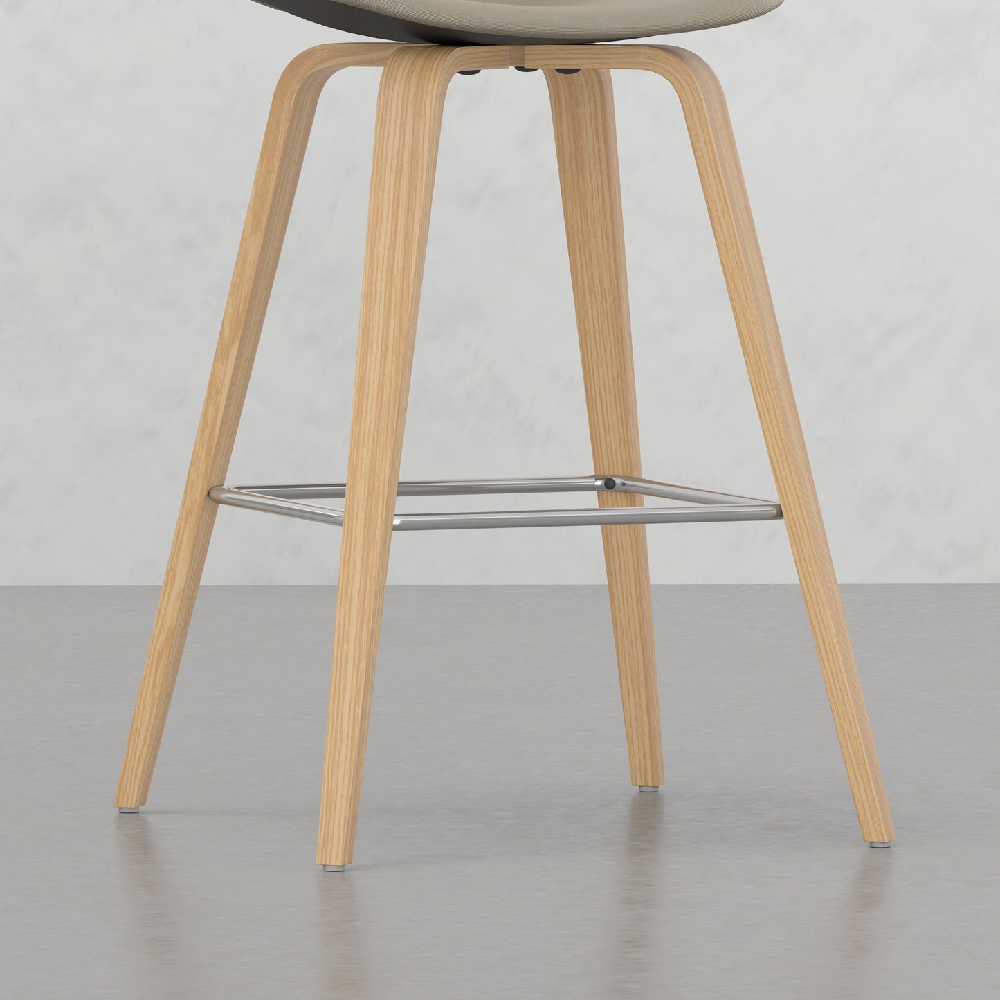 Modern beige upholstered bar stool with natural wood legs and chrome footrest