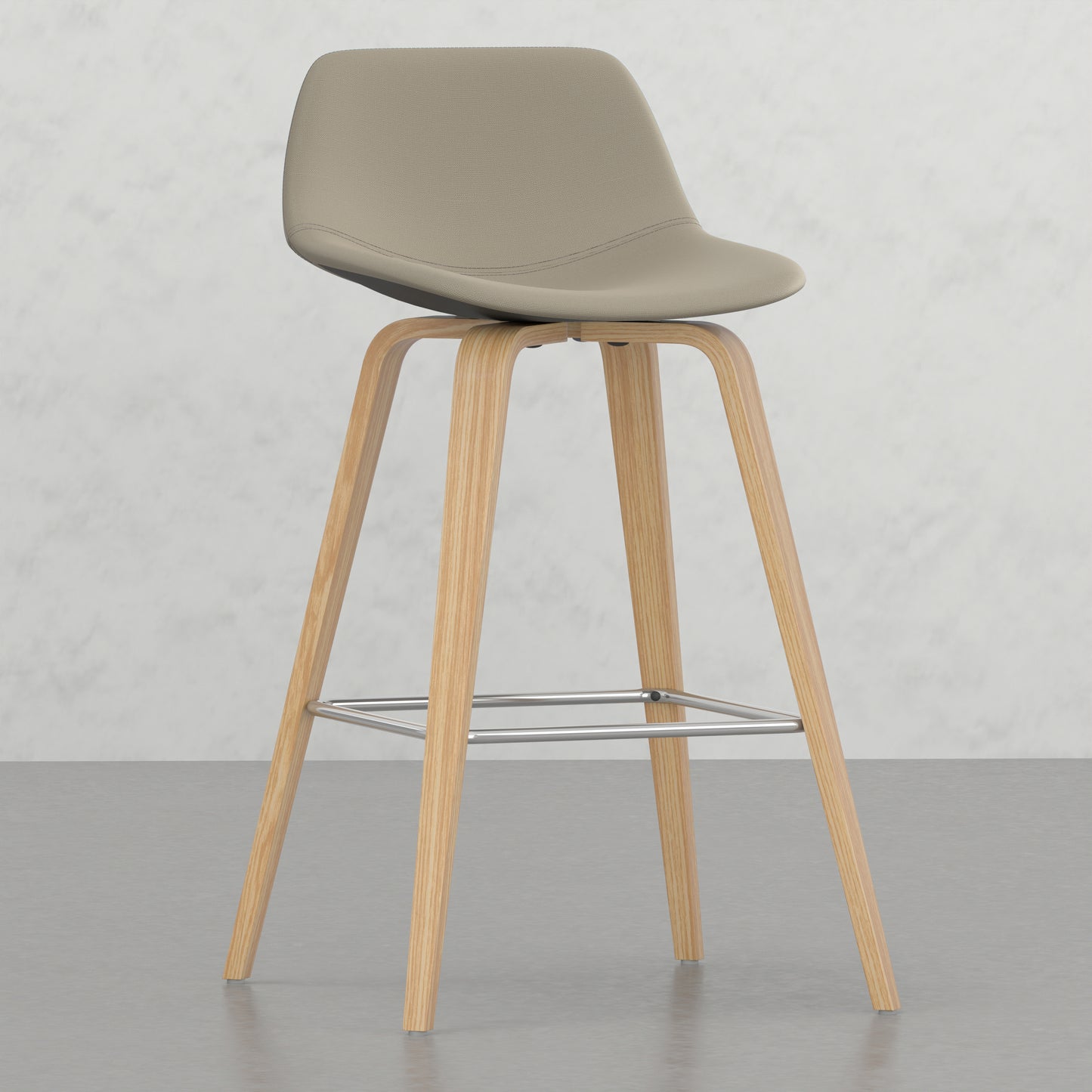 Beige fabric bar stool with light wood legs and chrome footrest