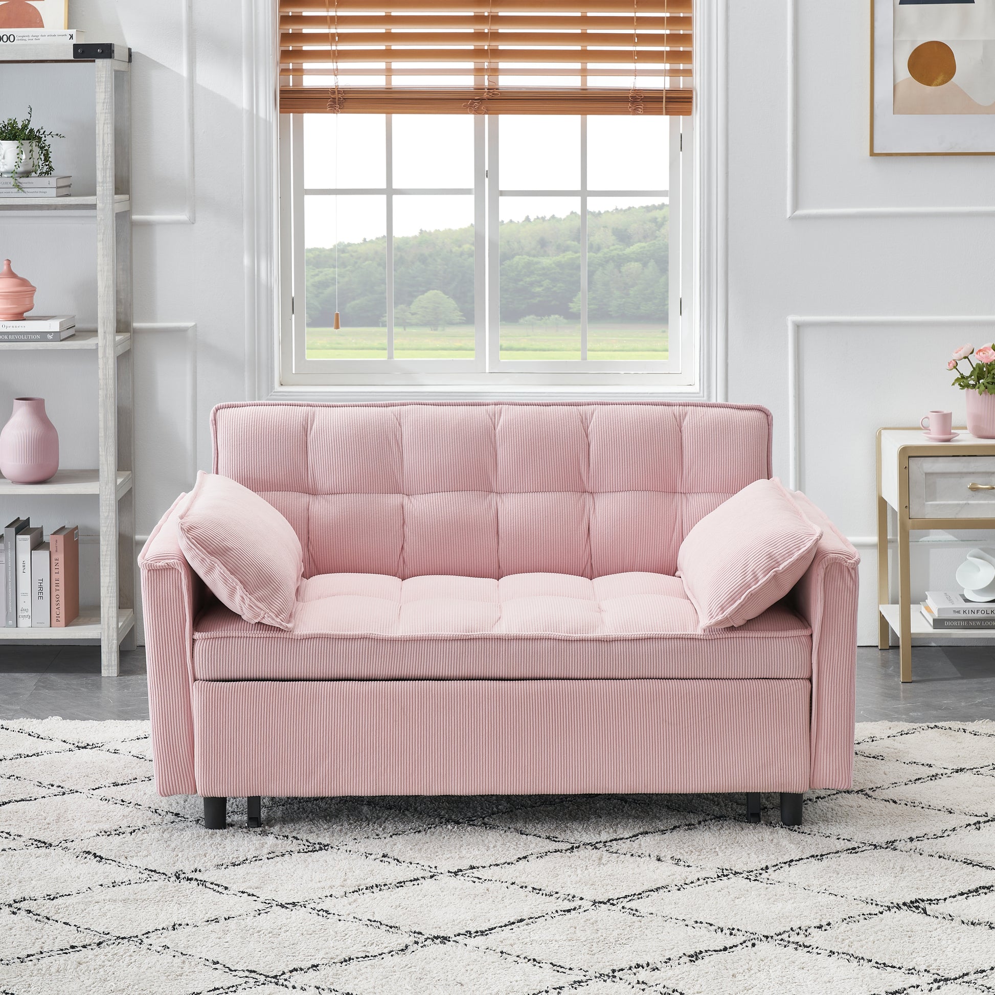 Pink corduroy sofa with tufted cushions and two throw pillows perfect for a cozy living room