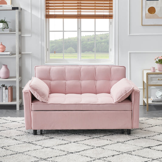 Pink corduroy sofa with tufted cushions and two throw pillows perfect for a cozy living room