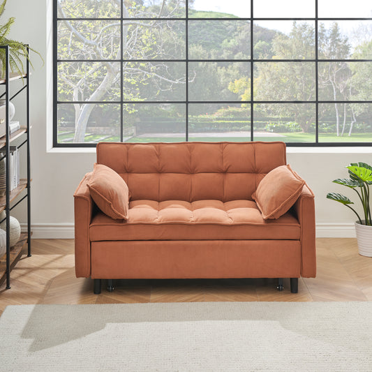 Terracotta corduroy sofa with tufted seat and back featuring two plush pillows