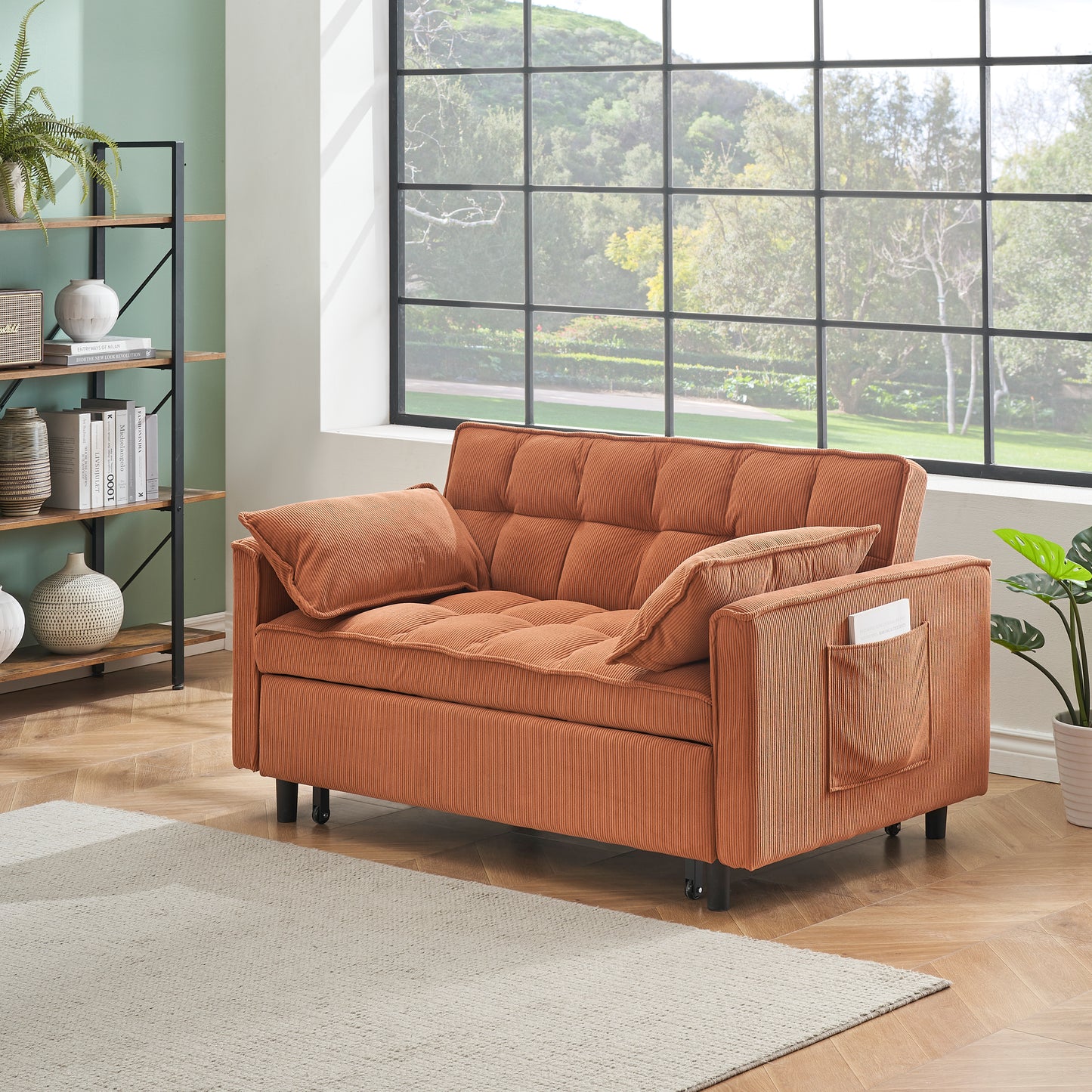 Orange corduroy futon sofa with tufted cushions and side pocket perfect for small spaces