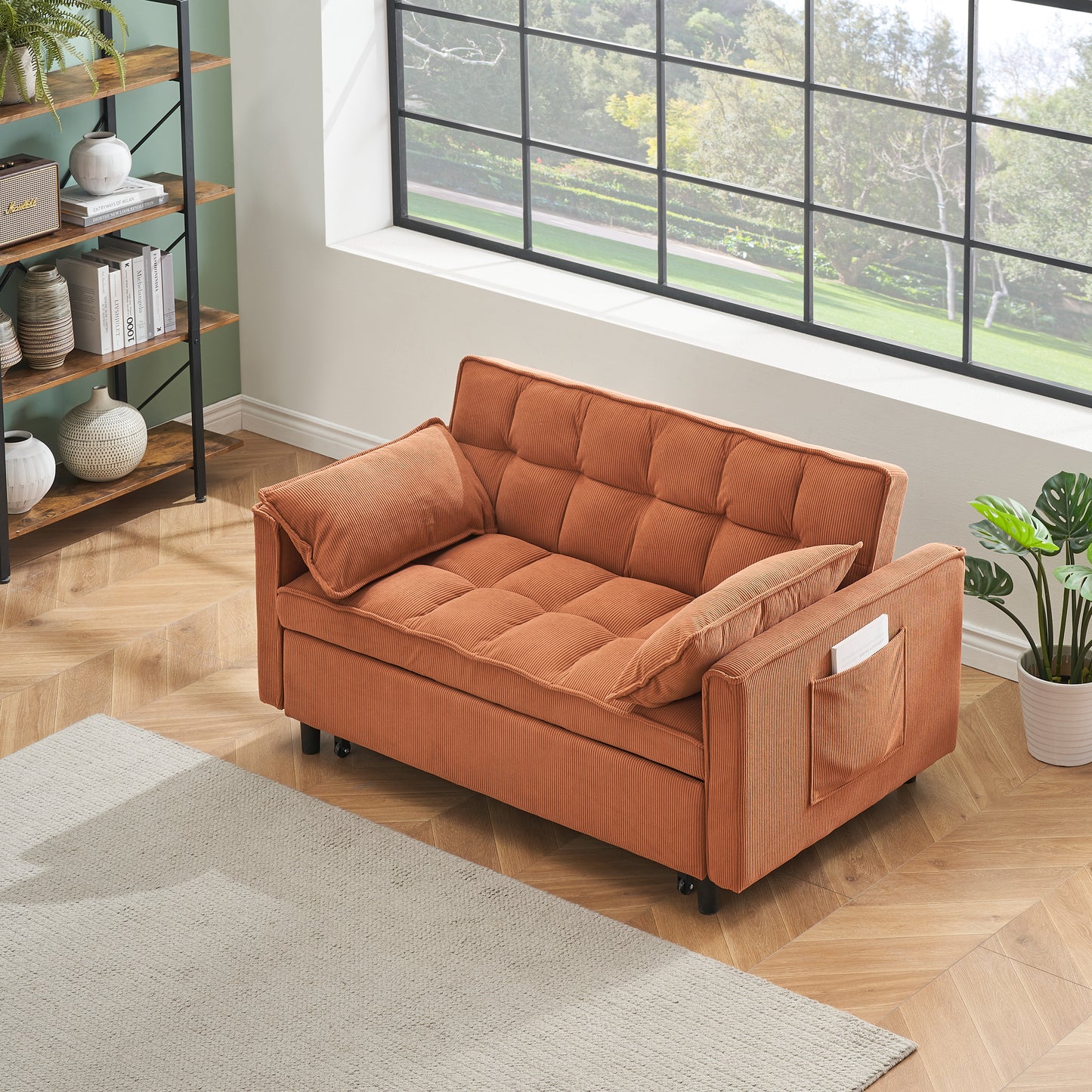 Orange corduroy convertible sofa with tufted cushions and side pocket