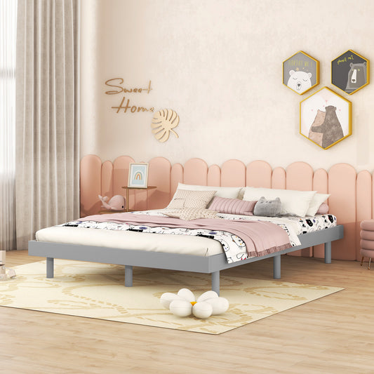 Gray metal twin bed frame with playful bedding