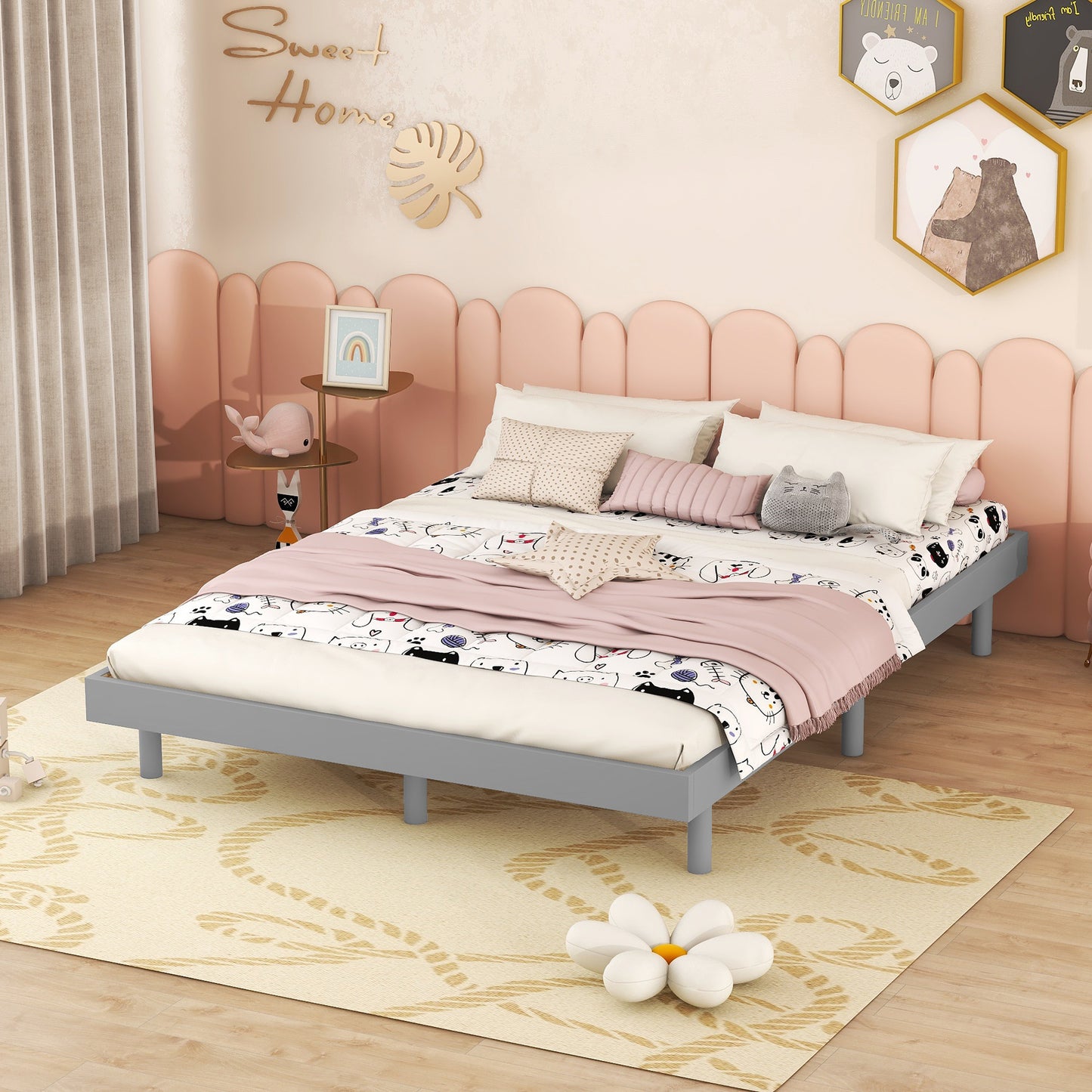 Gray metal twin bed frame with playful catthemed bedding