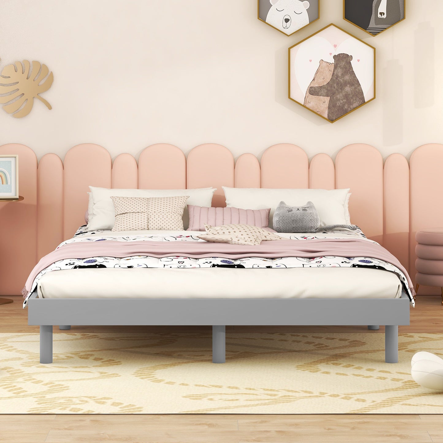 Modern grey metal bed frame with playful pillows and a whimsical duvet cover  chars