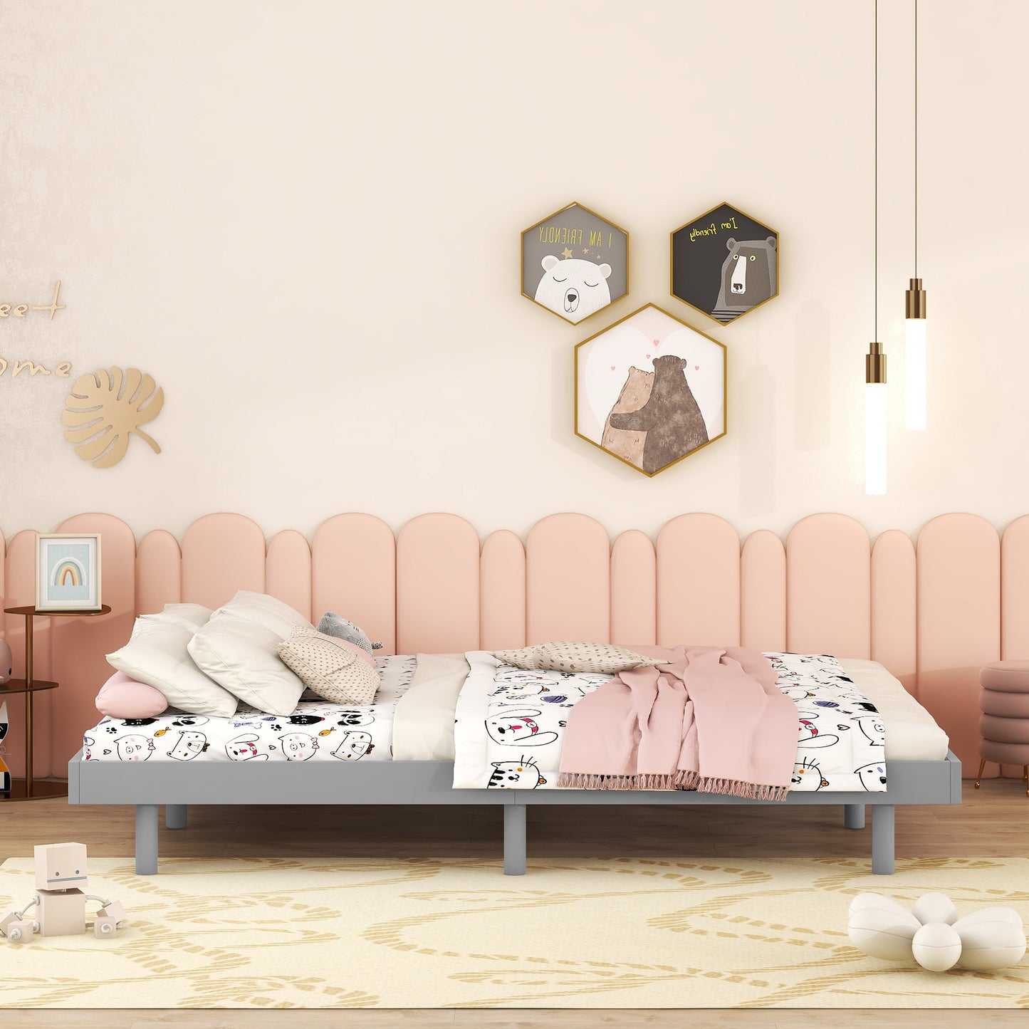 Gray metal twin bed frame with playful cartoon animal bedding