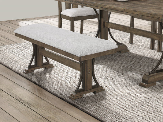 Farmhouse dining bench with upholstered light gray seat and dark wood frame
