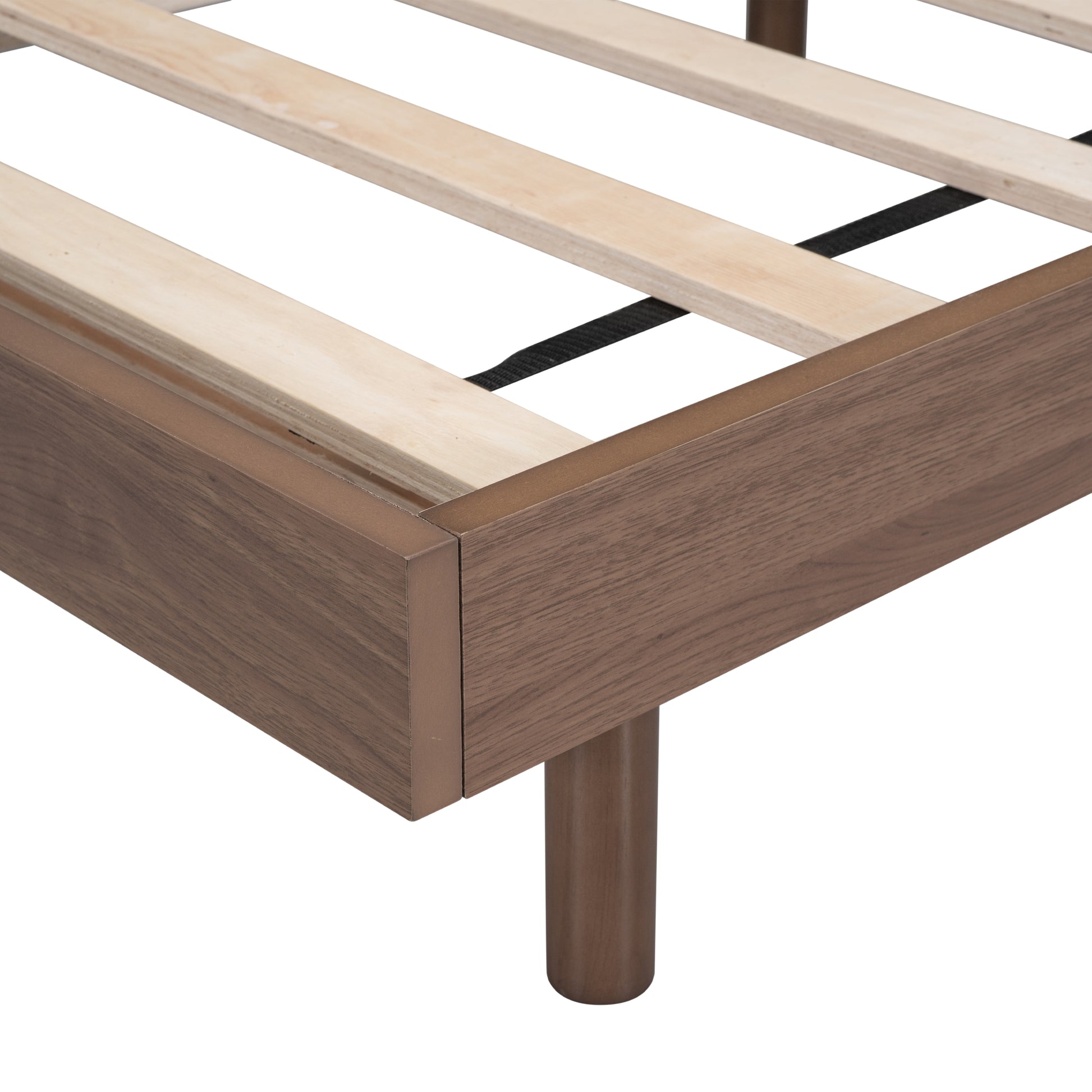 Walnut wood bed frame corner detail with visible slats and legs