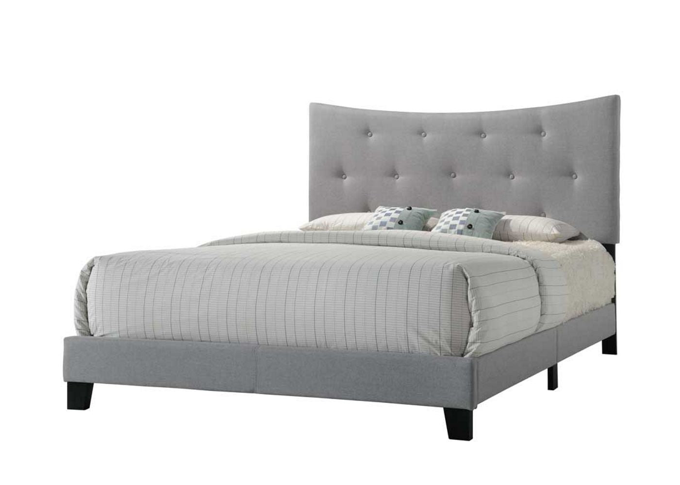 Grey upholstered bed frame with tufted headboard and striped linens