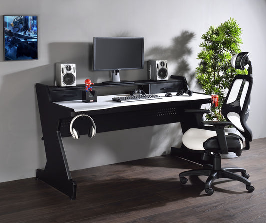 Black and white gaming desk with builtin headphone rack and accessories
