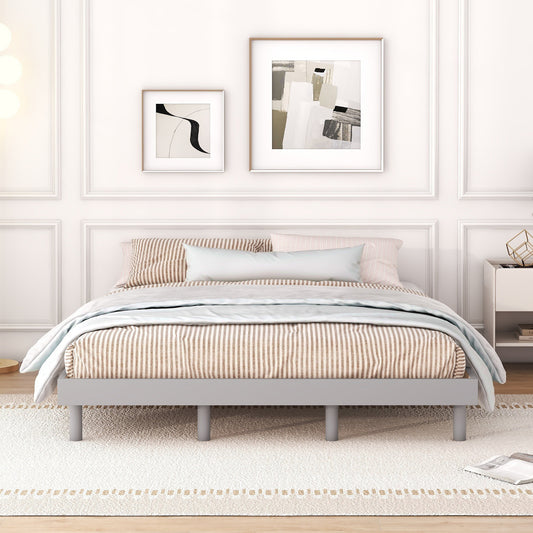 Gray metal bed frame with brown and white striped bedding