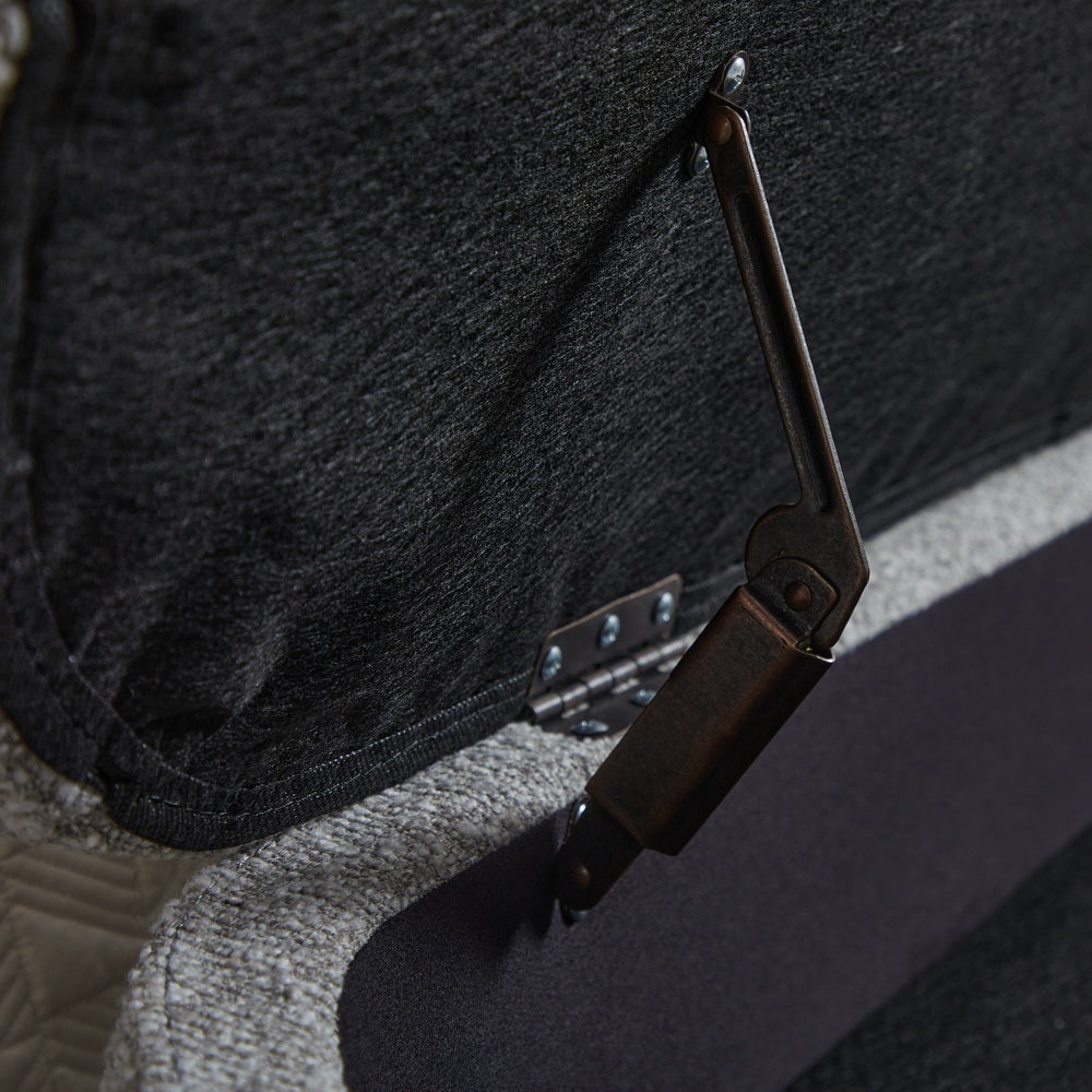 Bronze lifttop mechanism on dark upholstered storage ottoman
