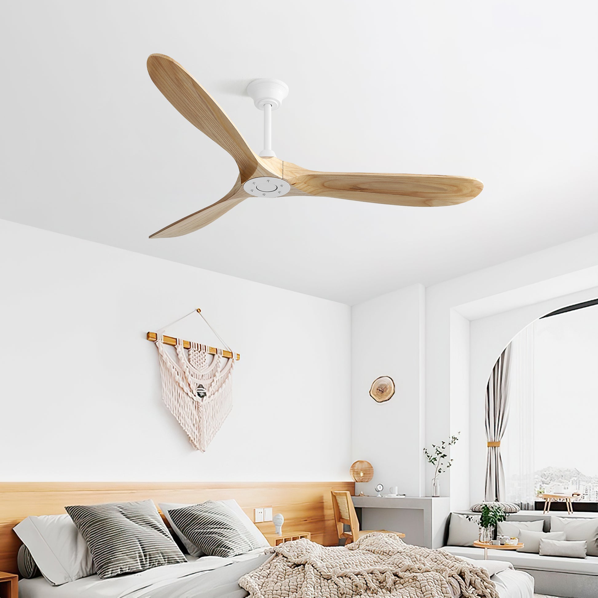 Natural wood blade ceiling fan with a sleek modern design complementing a minimalist bedroom