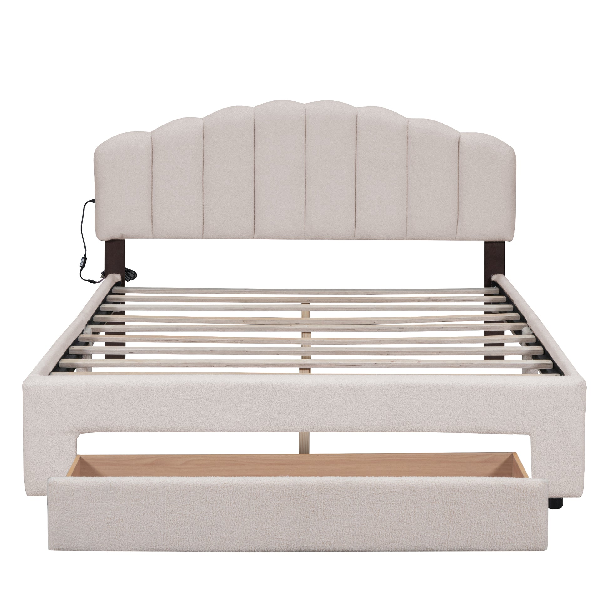 Beige boucle upholstered bed frame with scalloped headboard and storage drawer