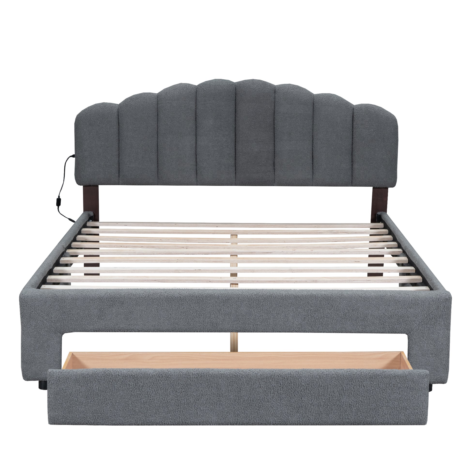 Gray upholstered platform bed frame with scallop headboard and builtin storage drawer