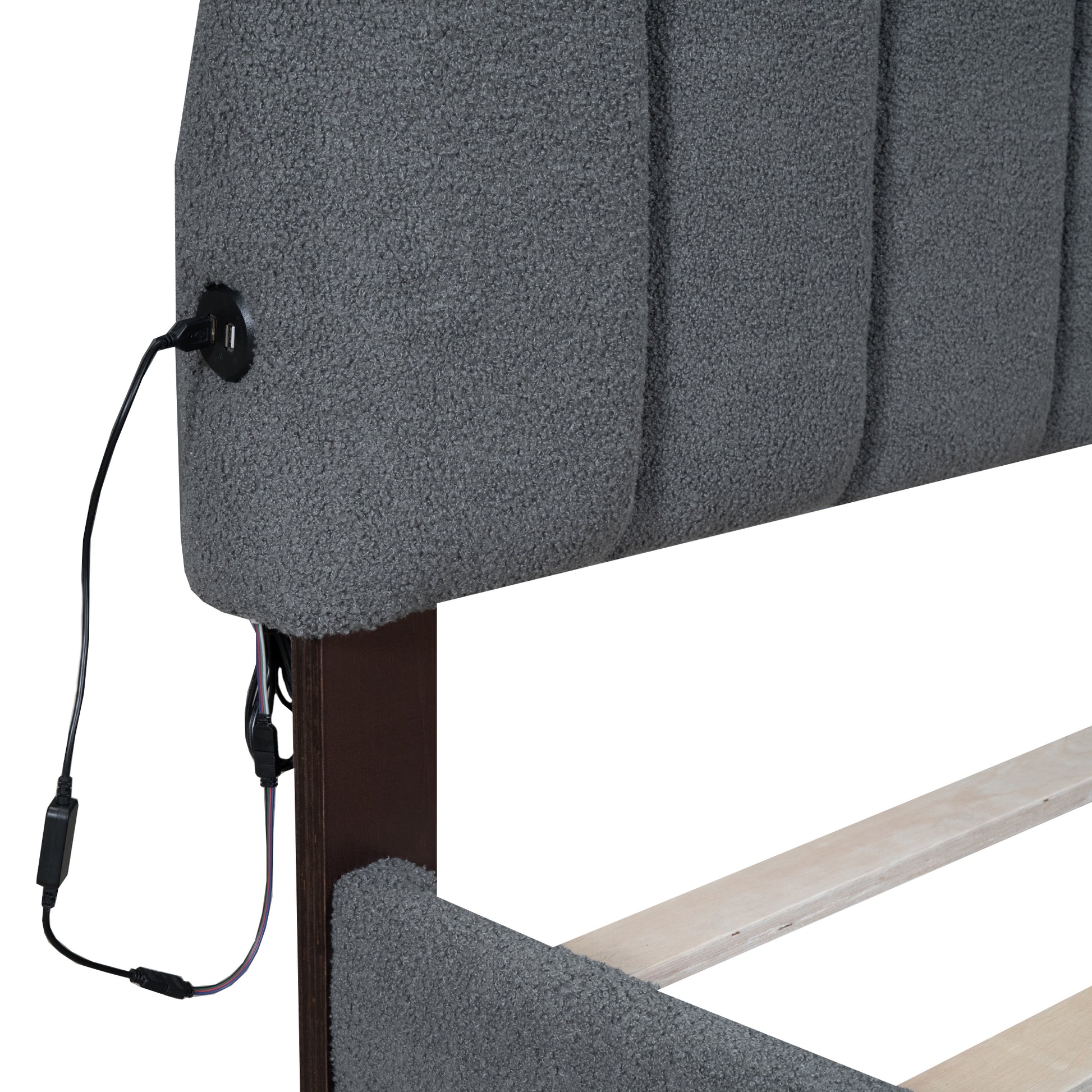 Gray upholstered headboard with integrated USB charging ports
