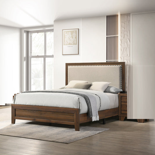 Upholstered headboard bed frame with dark wood finish and neutral linens