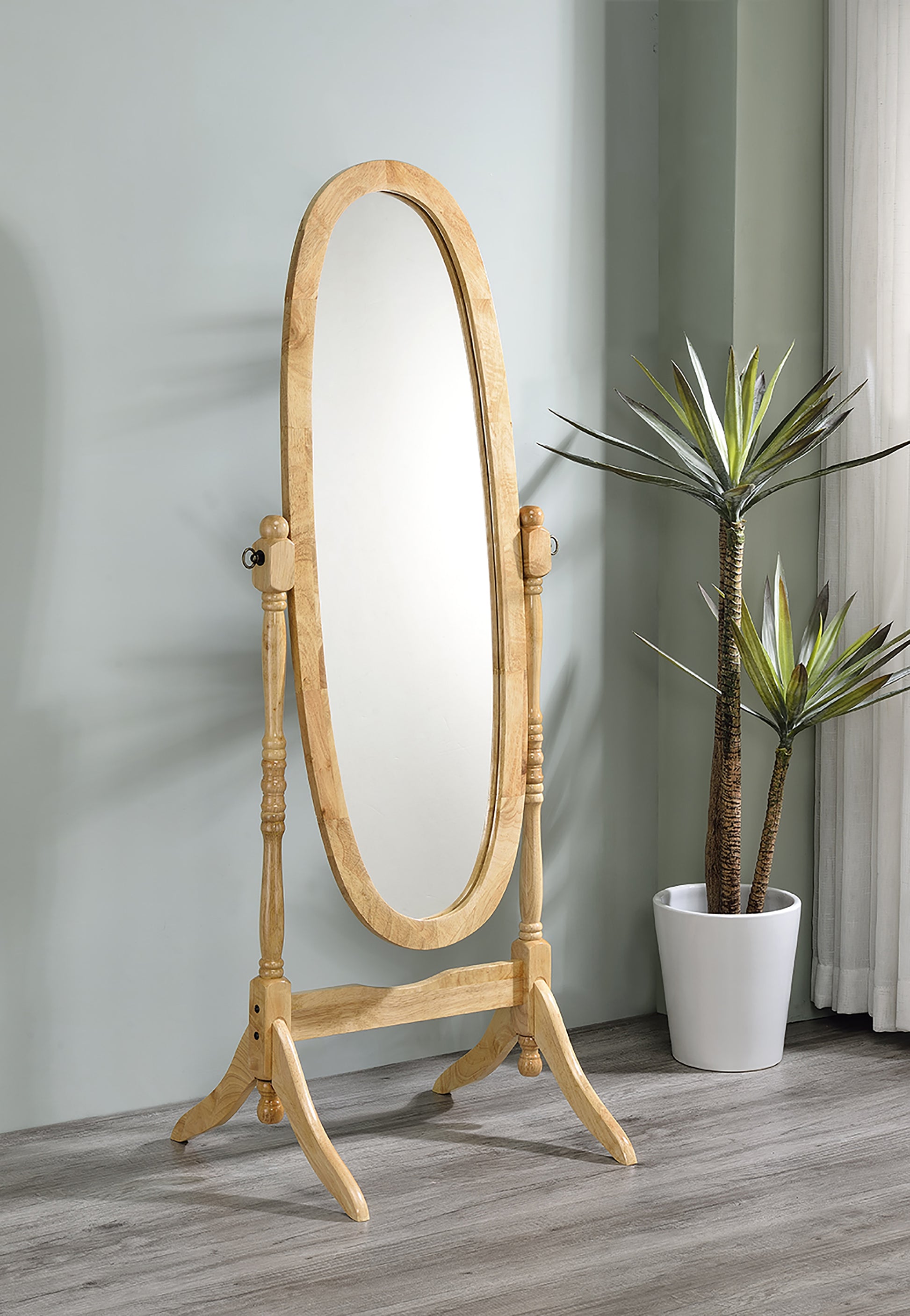 Natural wood oval cheval mirror with ornate stand and adjustable tilt perfect for bedrooms