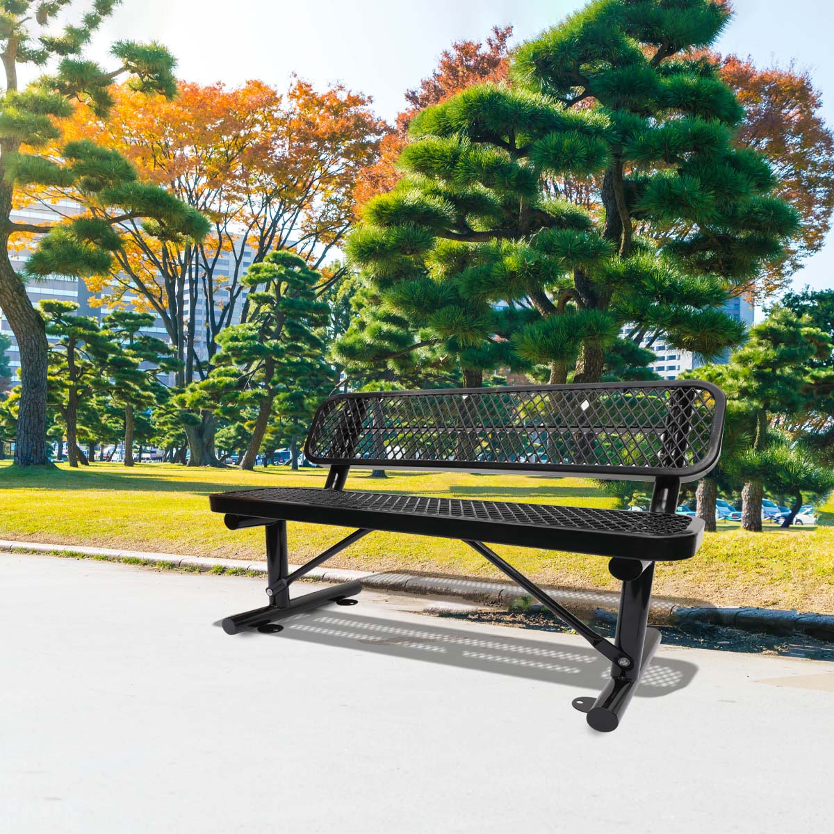 Black metal park bench with diamondshaped perforations for outdoor seating