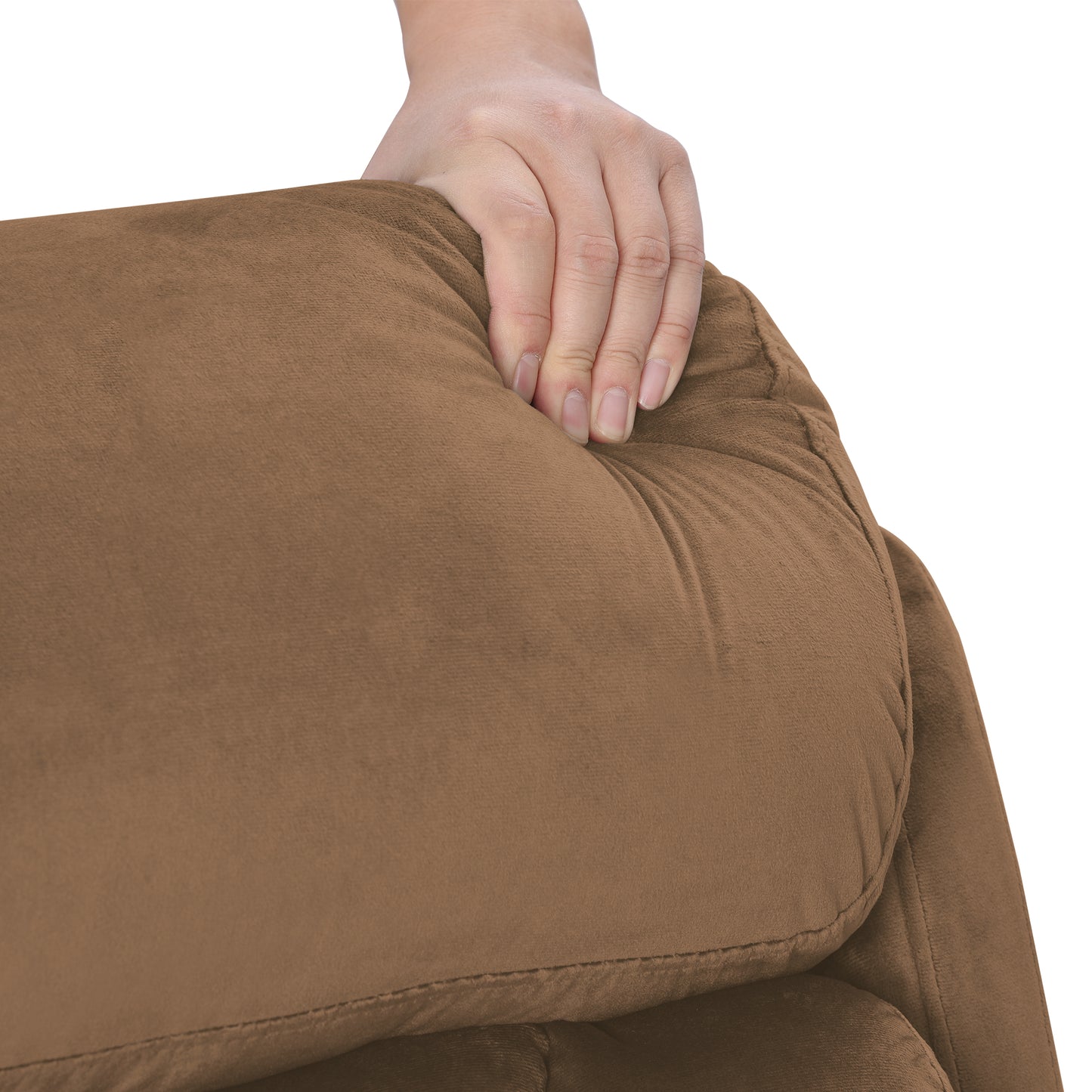 Closeup of hand pressing into plush brown velvet sofa cushion highlighting comfort