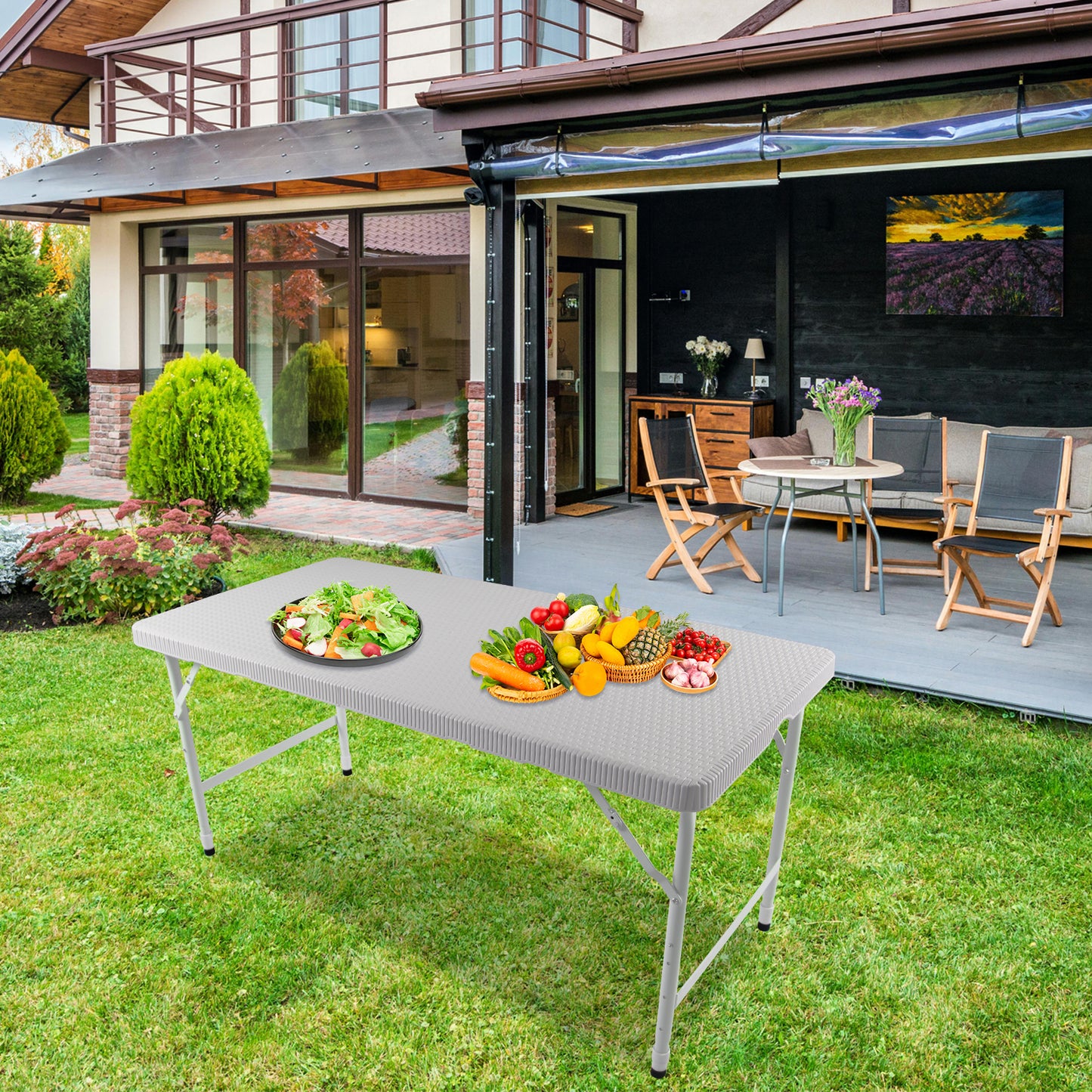 White folding picnic table with salad and fresh produce