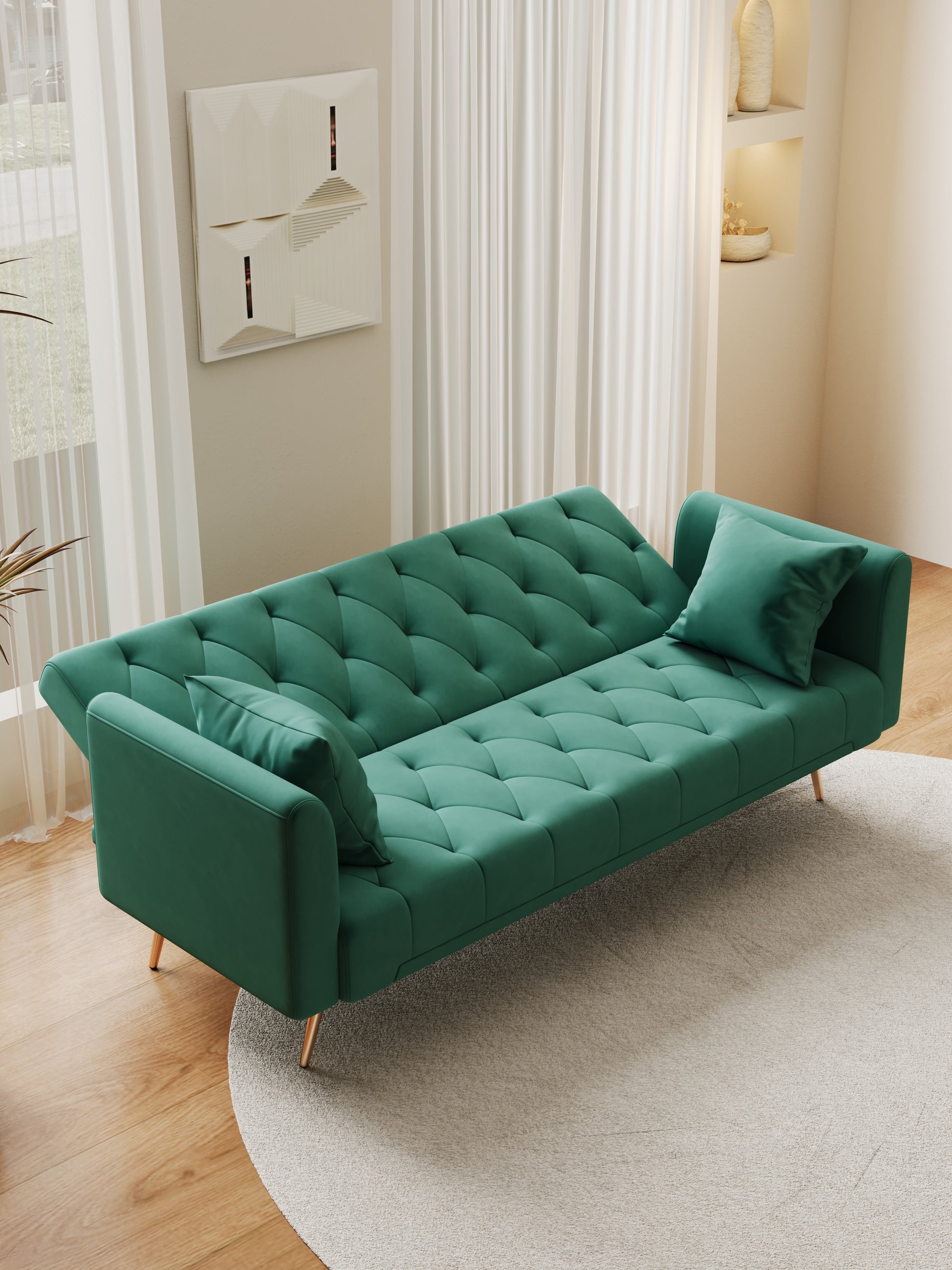 Emerald green velvet tufted sofa with gold legs perfect for small apartment living
