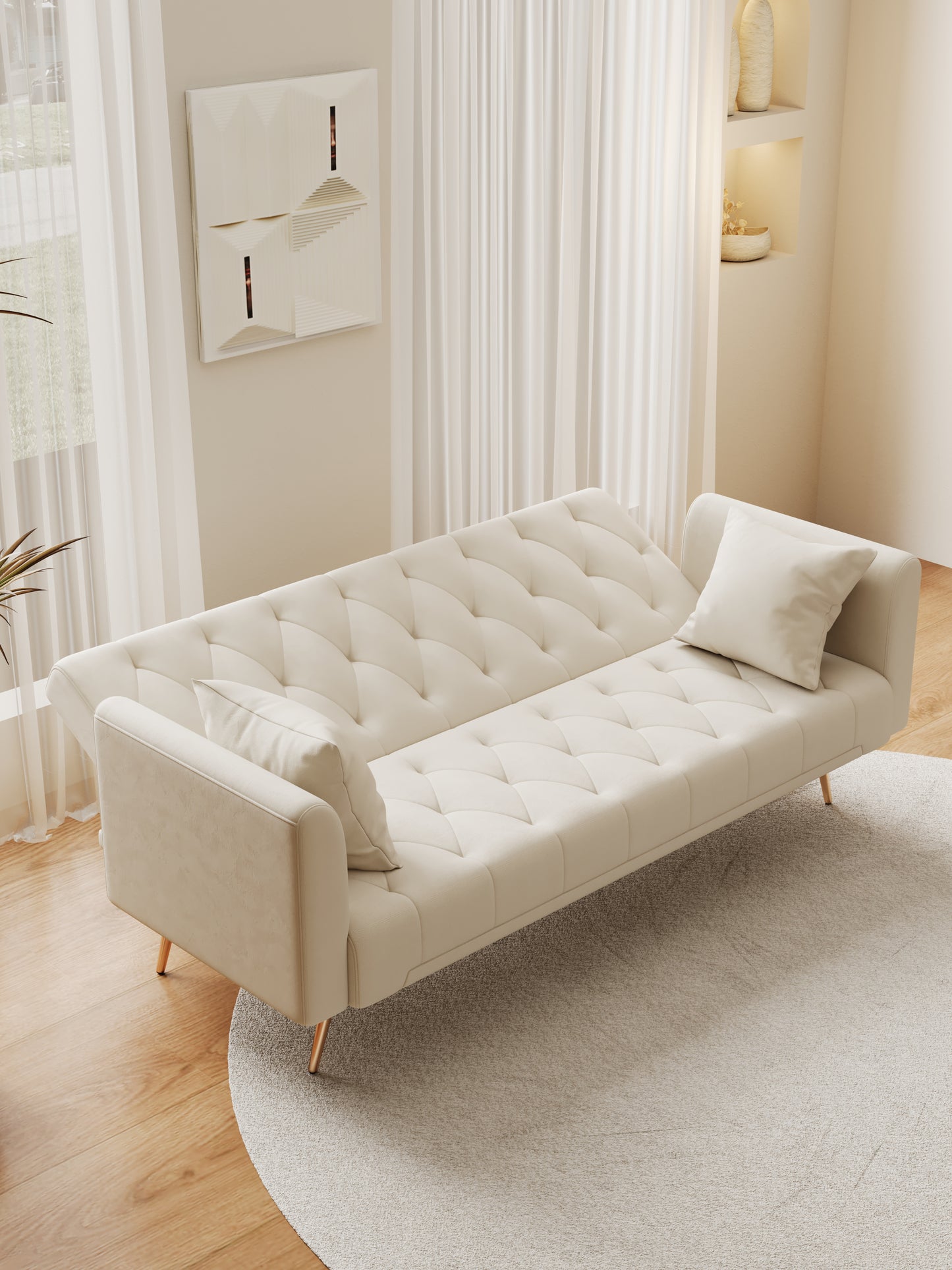 Tufted cream velvet sofa with button detailing and modern gold legs perfect for a living room