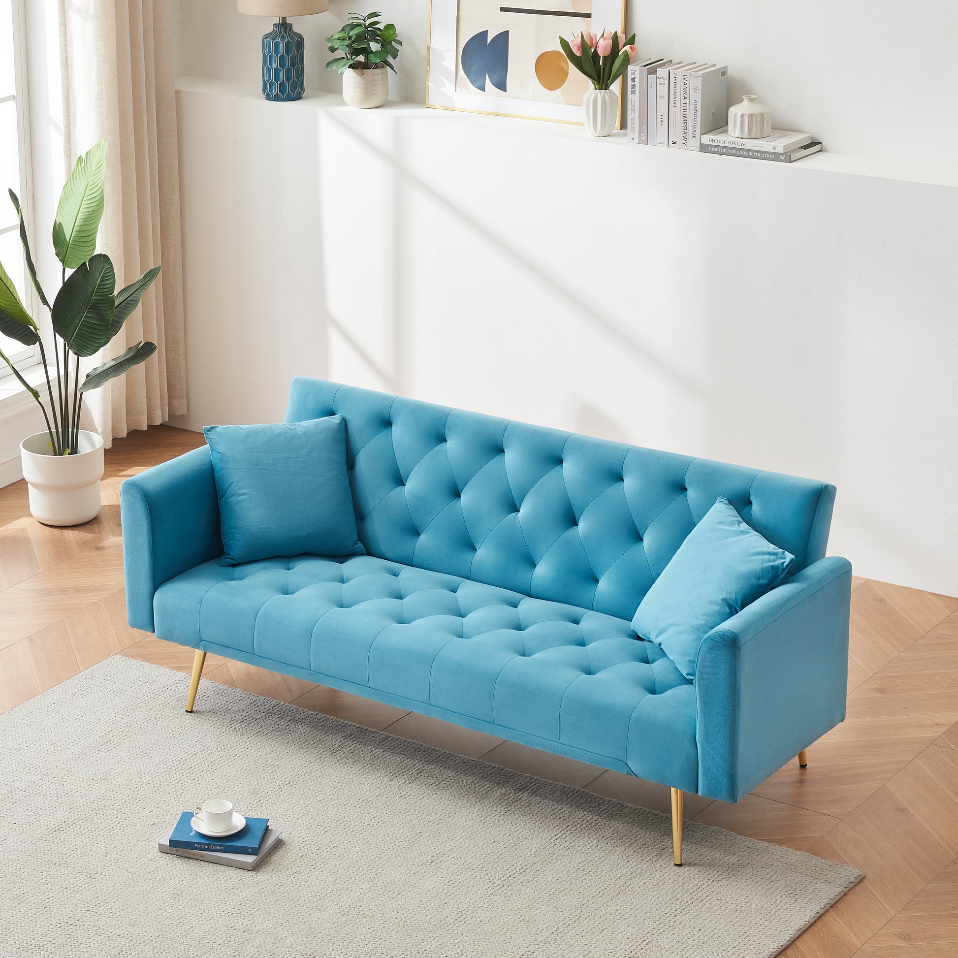 Tufted teal velvet sofa with gold legs a modern accent piece for living rooms