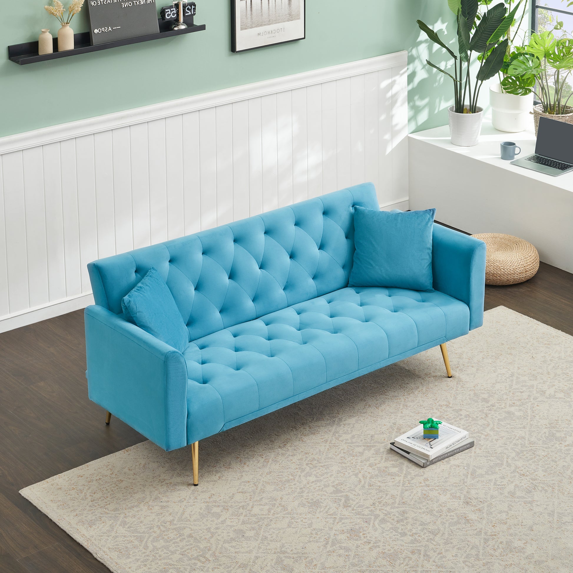 Turquoise velvet tufted sofa with gold legs and accent pillows for living room