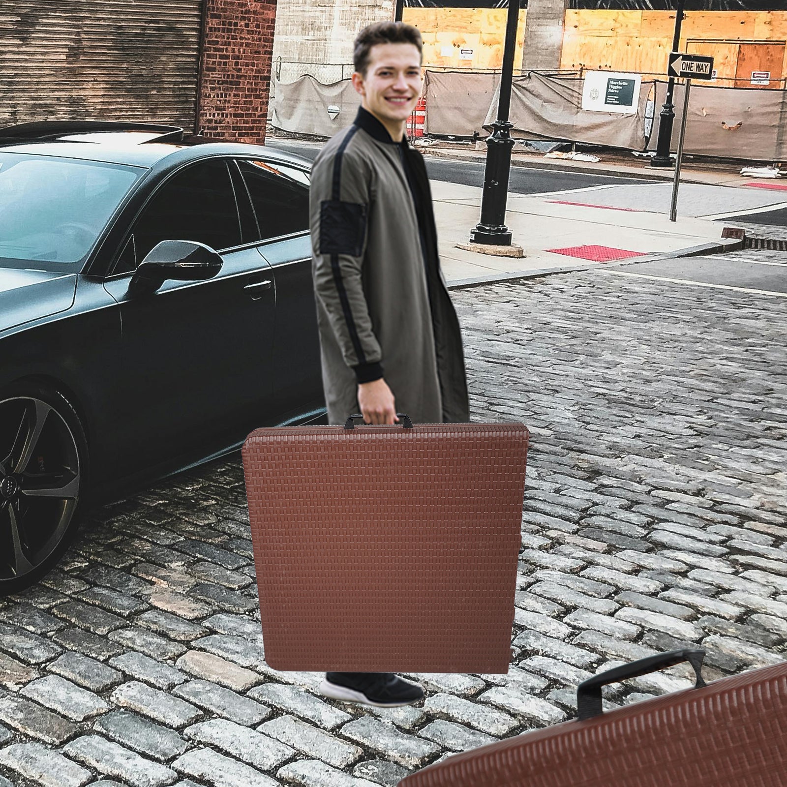 Brown woven hardshell suitcase with black handles ideal for travel